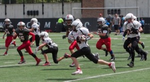 twelve year old football players fun on UC's Sheakley Field.